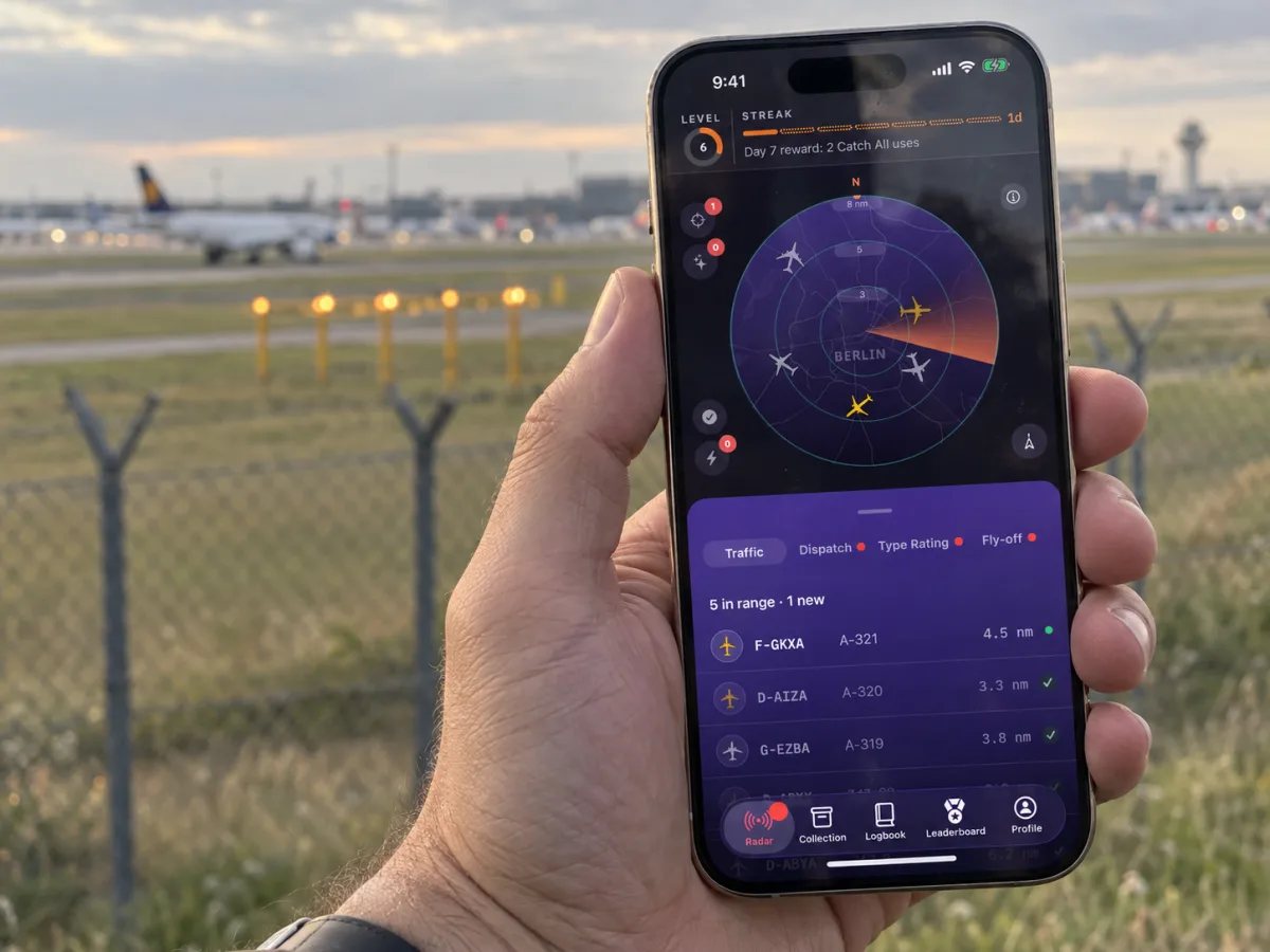 CatchFlights radar open on a phone at the edge of an airport